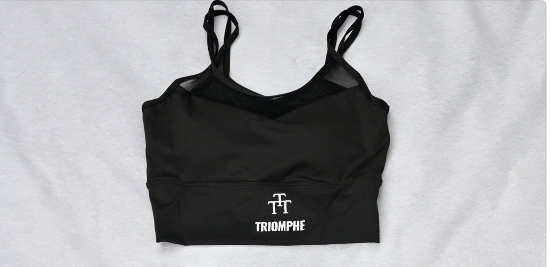 Haut sport féminin noir triomphe